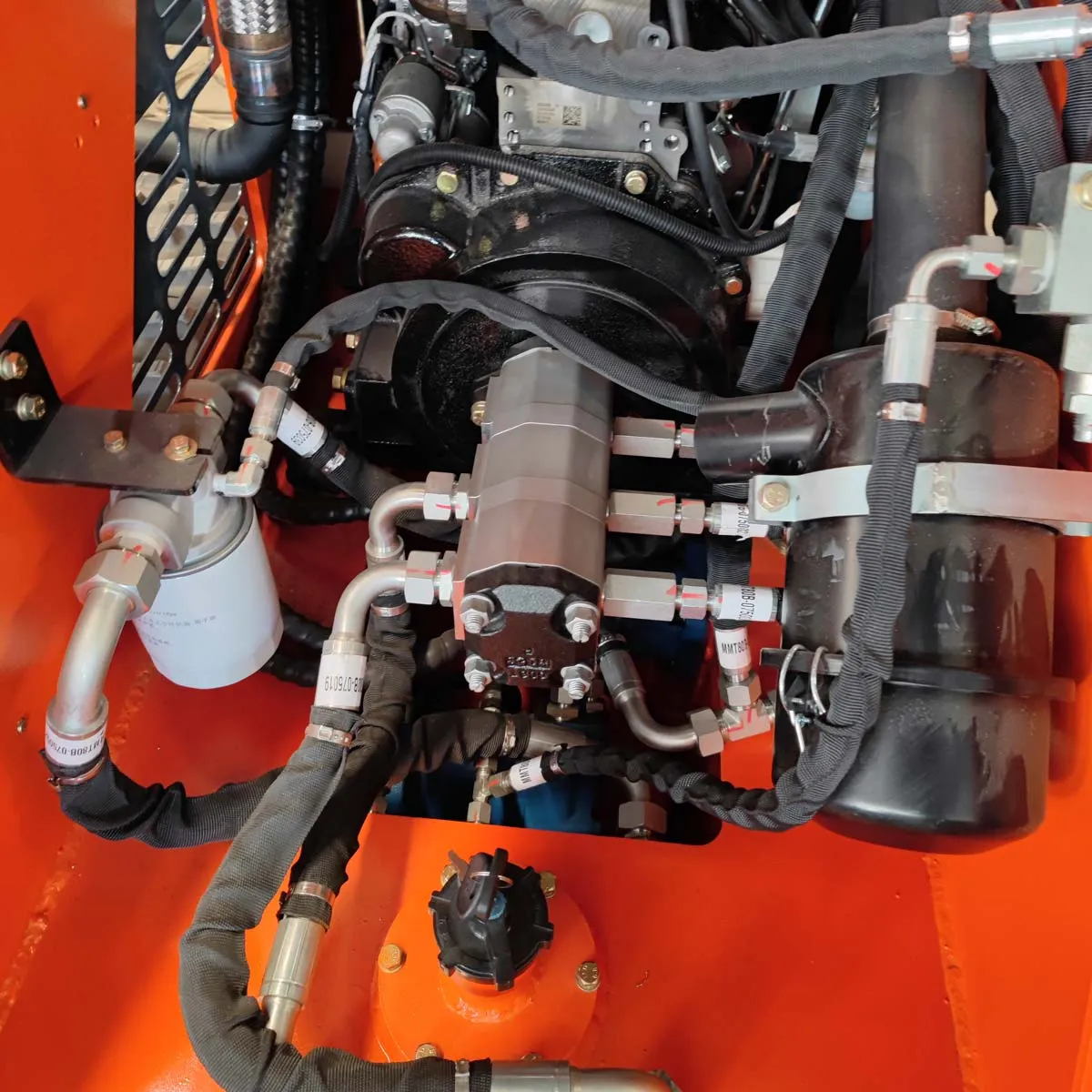 Compact and Powerful TMG Industrial 22 HP Honda Engine Stand-On Mini Track Loader - 750 lb Capacity with Eaton Hydraulic Motor, Permco Pump, Italian Hydro Control Valve, Joystick Controls, and Smooth Bucket (Model TMG-MVL22H)